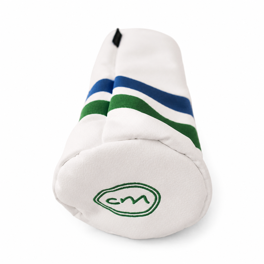 A white golf club headcover with blue and green stripes and a green embroidered 'cm' logo on the end cap, shown on a white background.