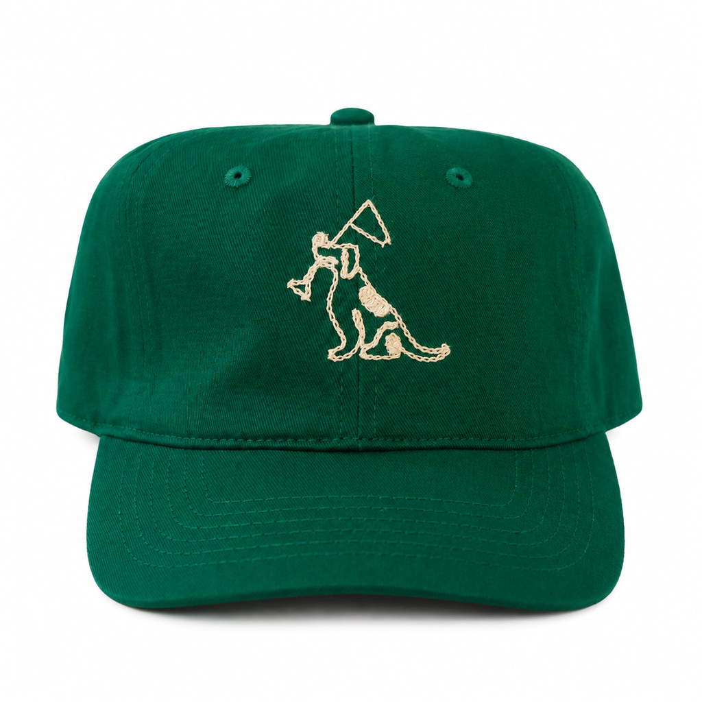 A green baseball cap featuring an embroidered graphic of a dog holding a flag on the front panel, set against a plain white background.
