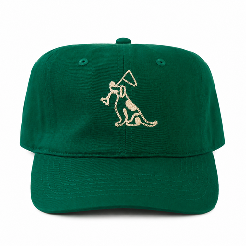 A green baseball cap featuring an embroidered graphic of a dog holding a flag on the front panel, set against a plain white background.