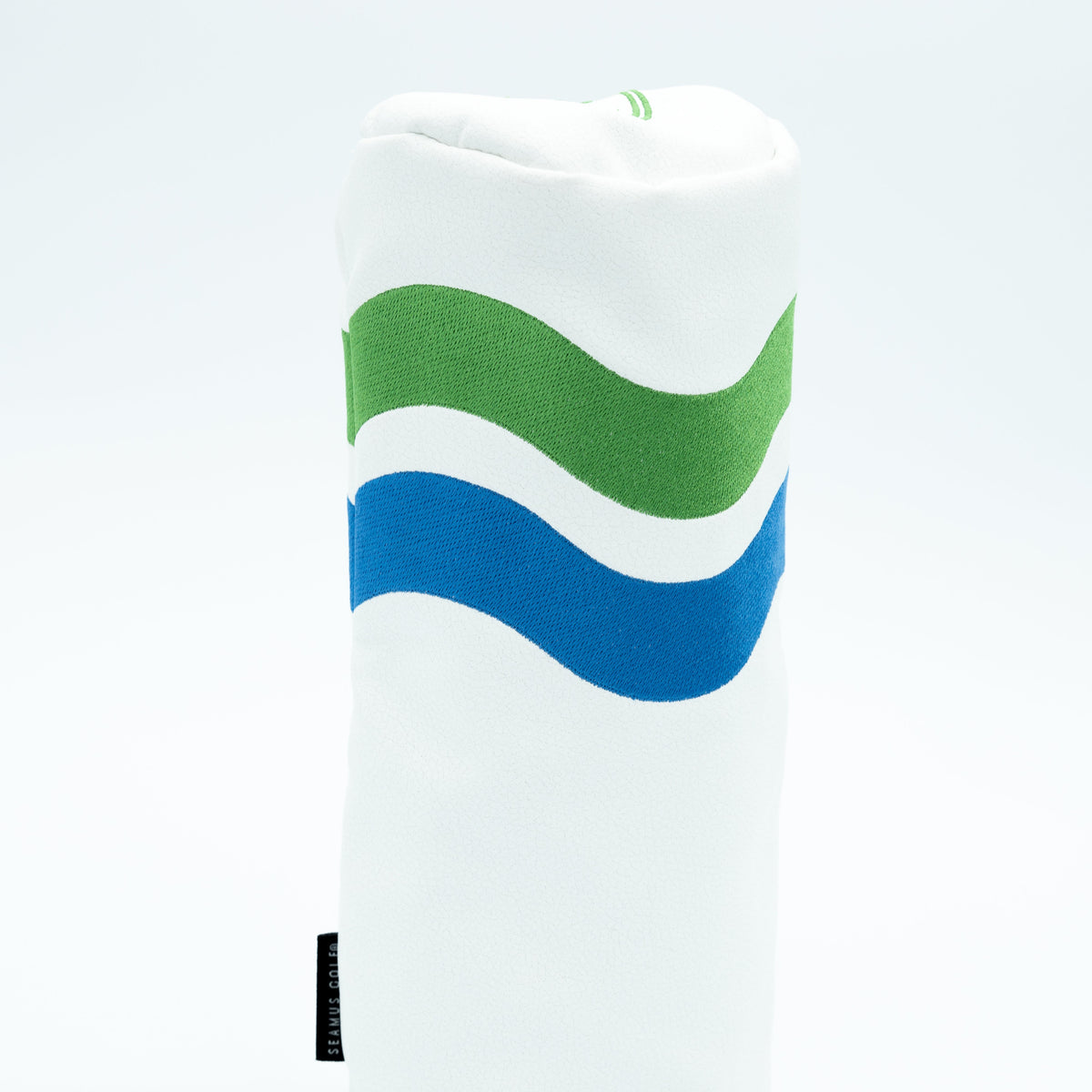 White head cover with green and blue wavy lines on a white background.