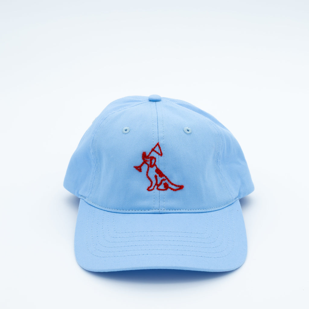 A light blue cotton baseball cap featuring a red embroidered dog logo on the front, set against a clean white background.