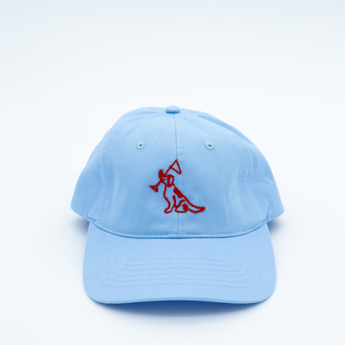 A light blue cotton baseball cap featuring a red embroidered dog logo on the front, set against a clean white background.