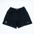 Black athletic shorts with an elastic waistband and a small white logo on the left leg, laid flat on a white background.