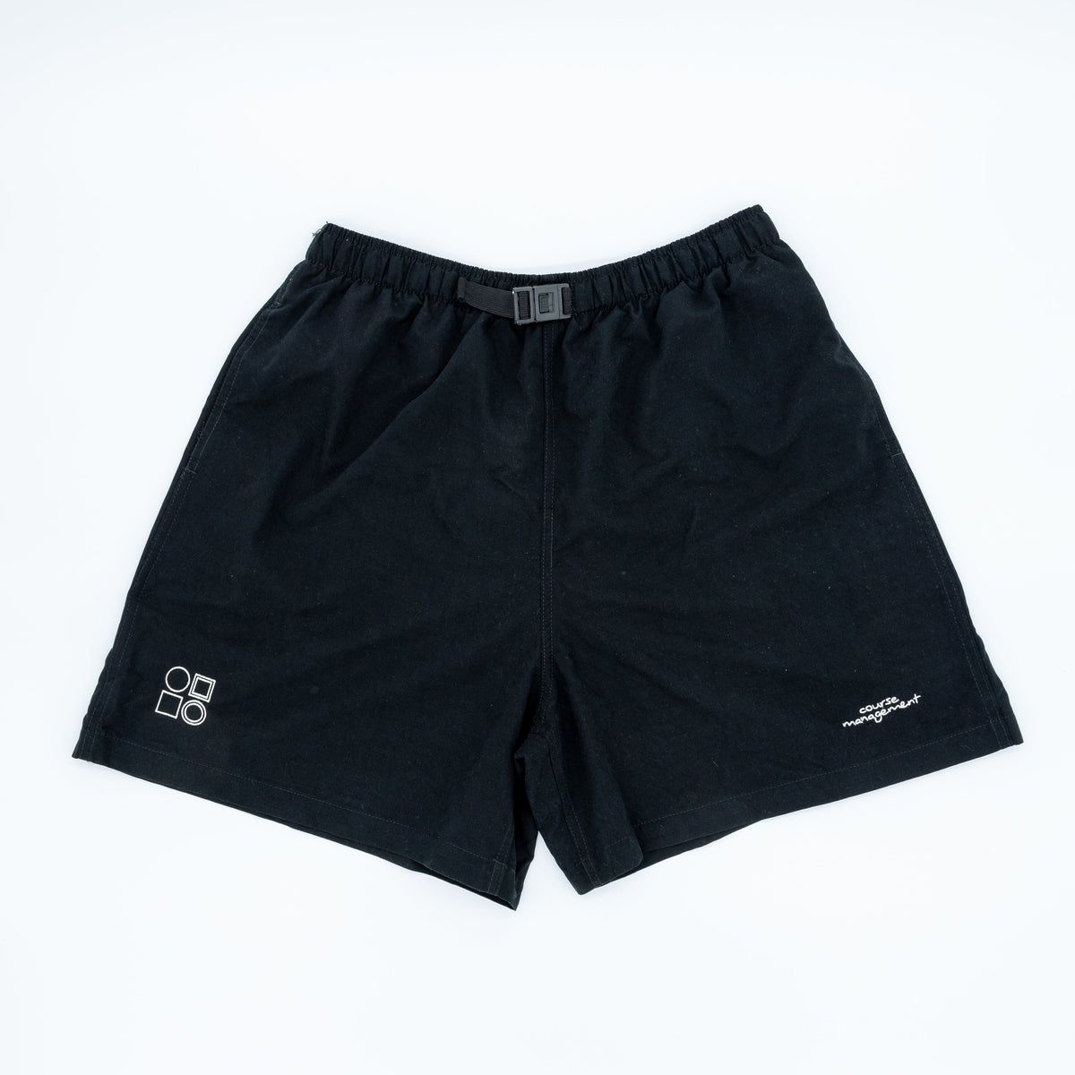Black athletic shorts with an elastic waistband and a small white logo on the left leg, laid flat on a white background.