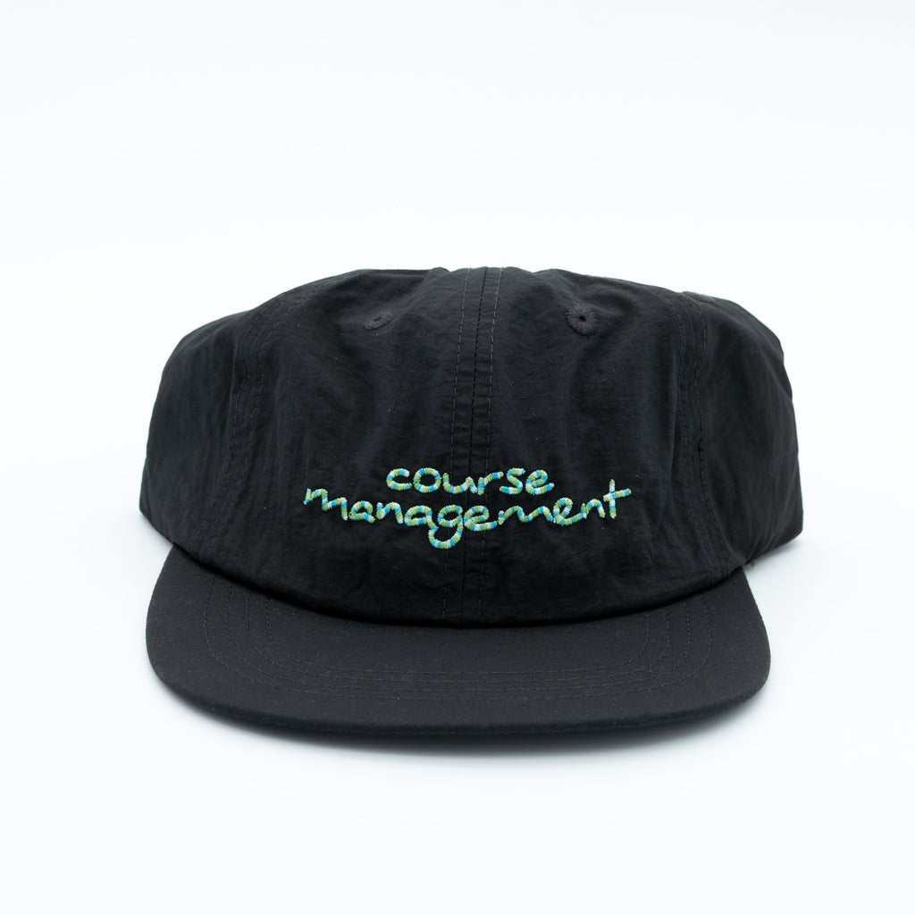 A black snapback cap with 'course management' embroidered in light green script on the front, set against a plain white background.