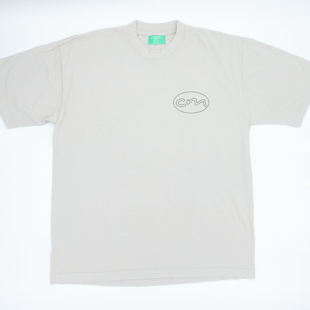 White t-shirt with oval CM logo on front right chest.