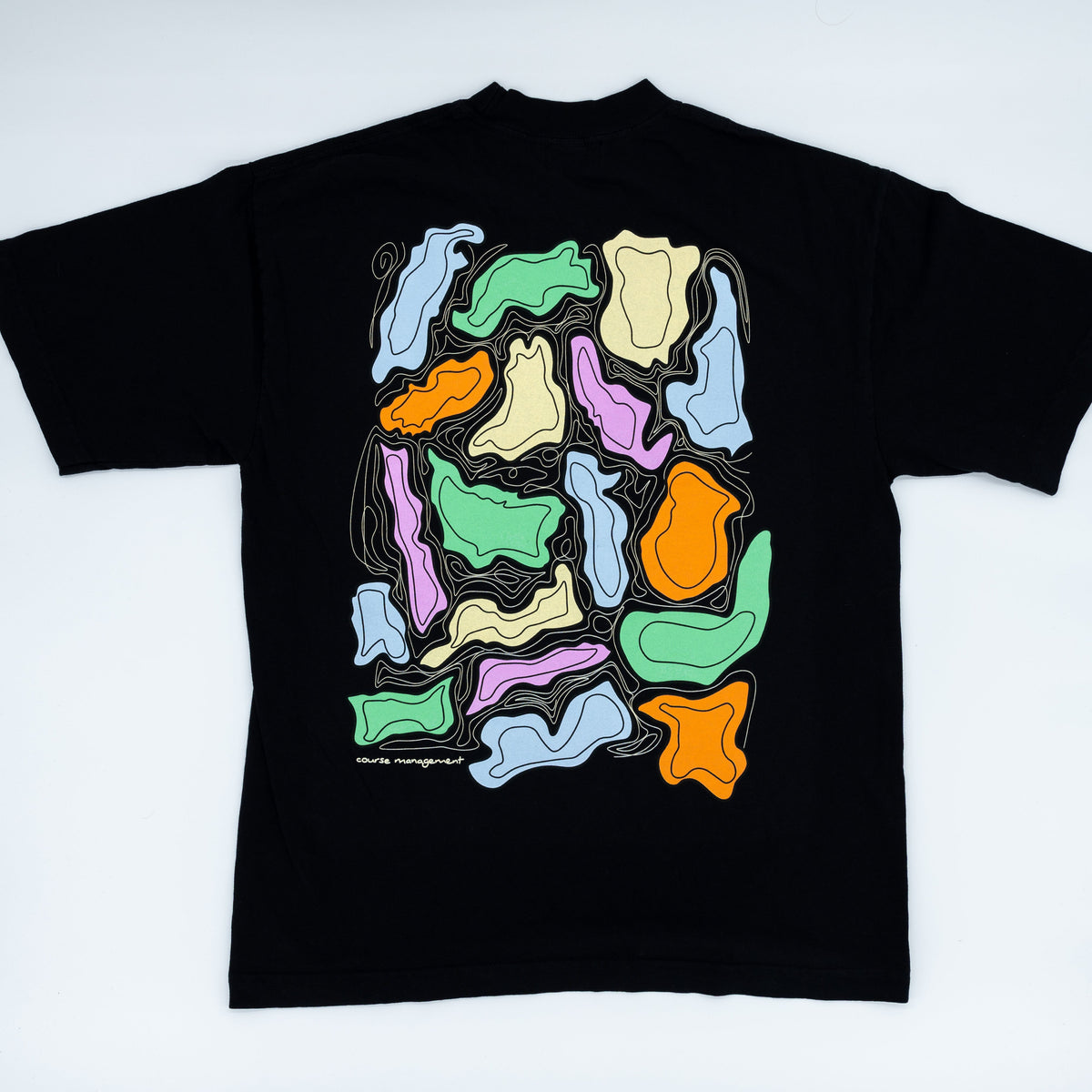 A black short-sleeve t-shirt laid flat on a light background, showing a large colorful abstract graphic print on the back. 